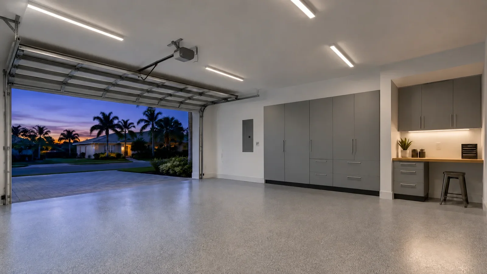 Garage with linear overhead lights and a defined work area