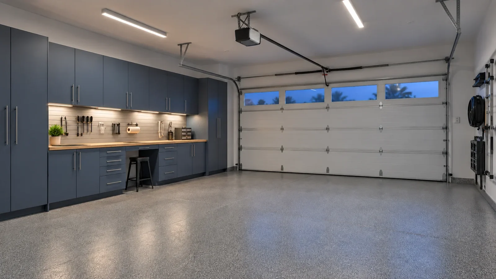 Garage with linear overhead lights and a defined work area